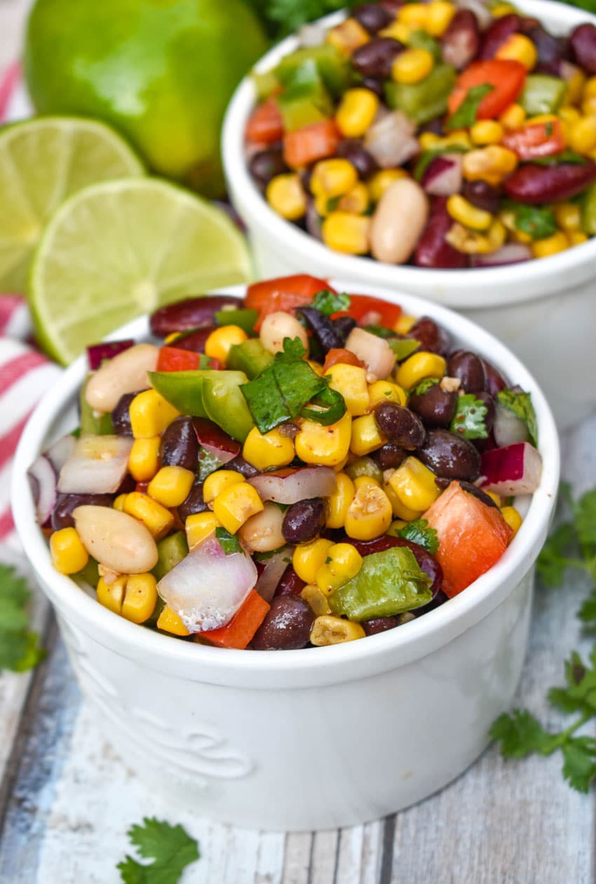 Mexican three bean salad in two small white bowls