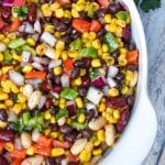 mexican three bean salad in a white serving bowl