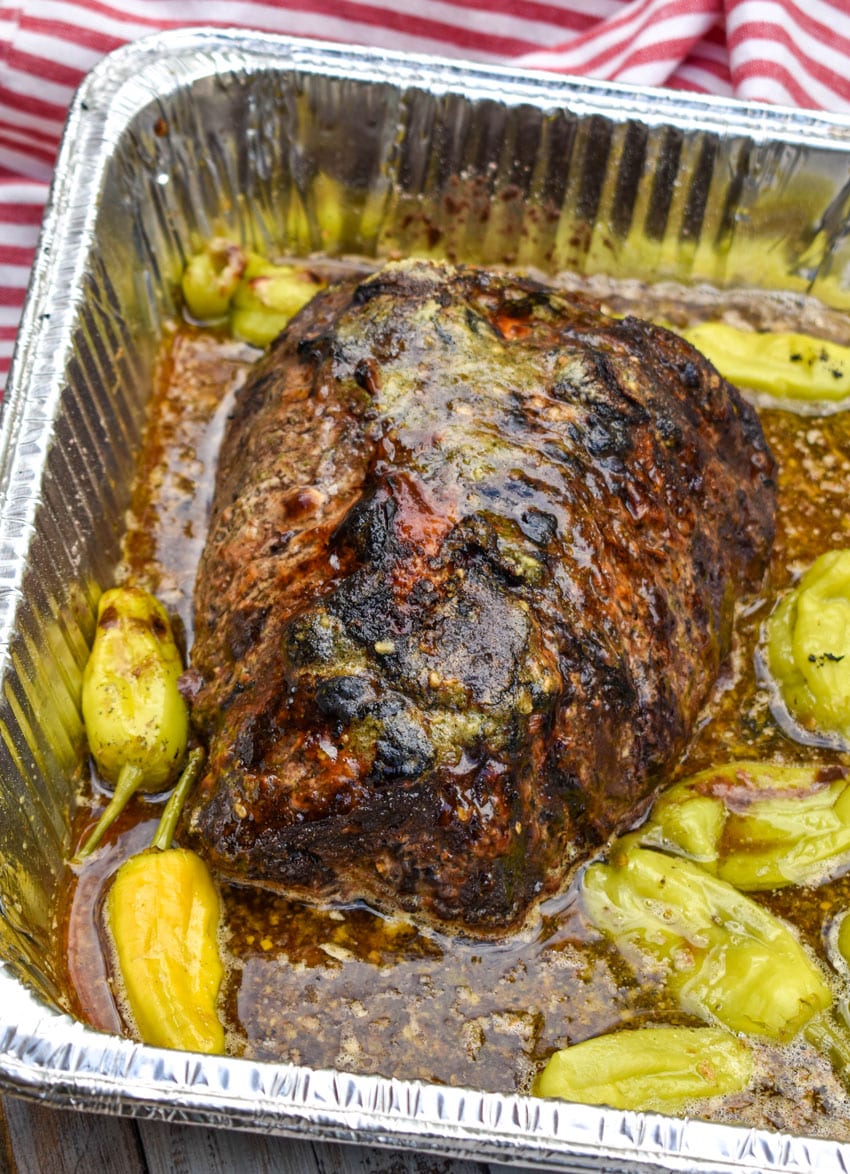 a smoked mississippi pot roast in an aluminum pan