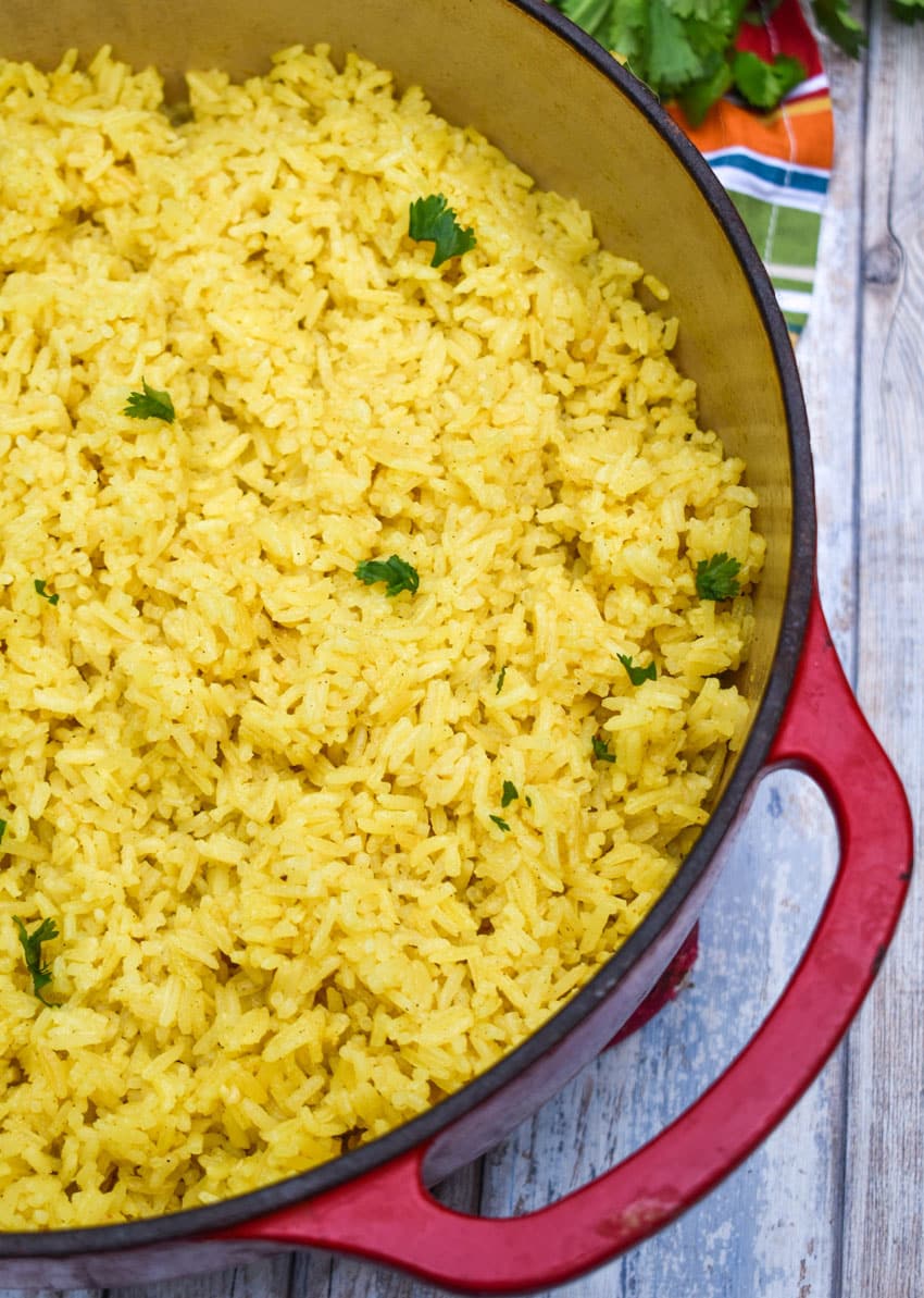 fluffy yellow basmati rice in a red dutch oven