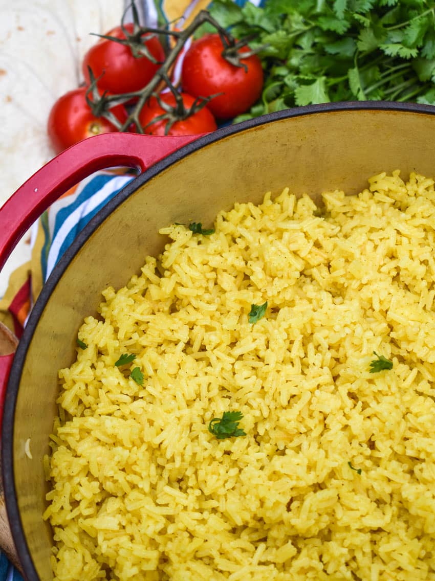 fluffy yellow basmati rice in a red dutch oven