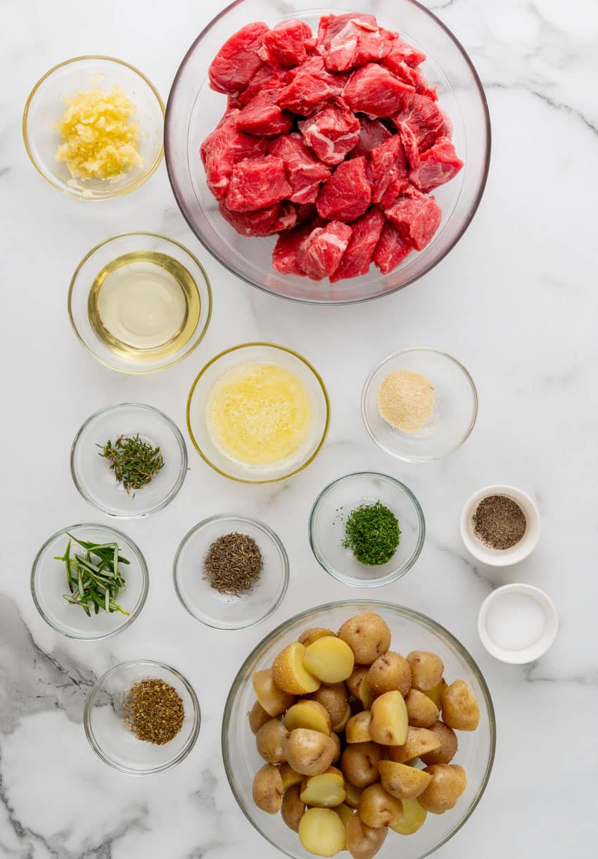 an overhead image showing the measured ingredients needed to make a batch of garlic butter grilled steak and potato foil packets