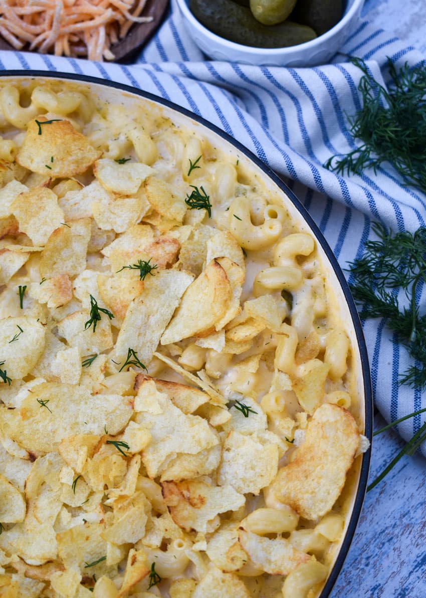 baked potato chip topped dill pickle mac and cheese in a large skillet