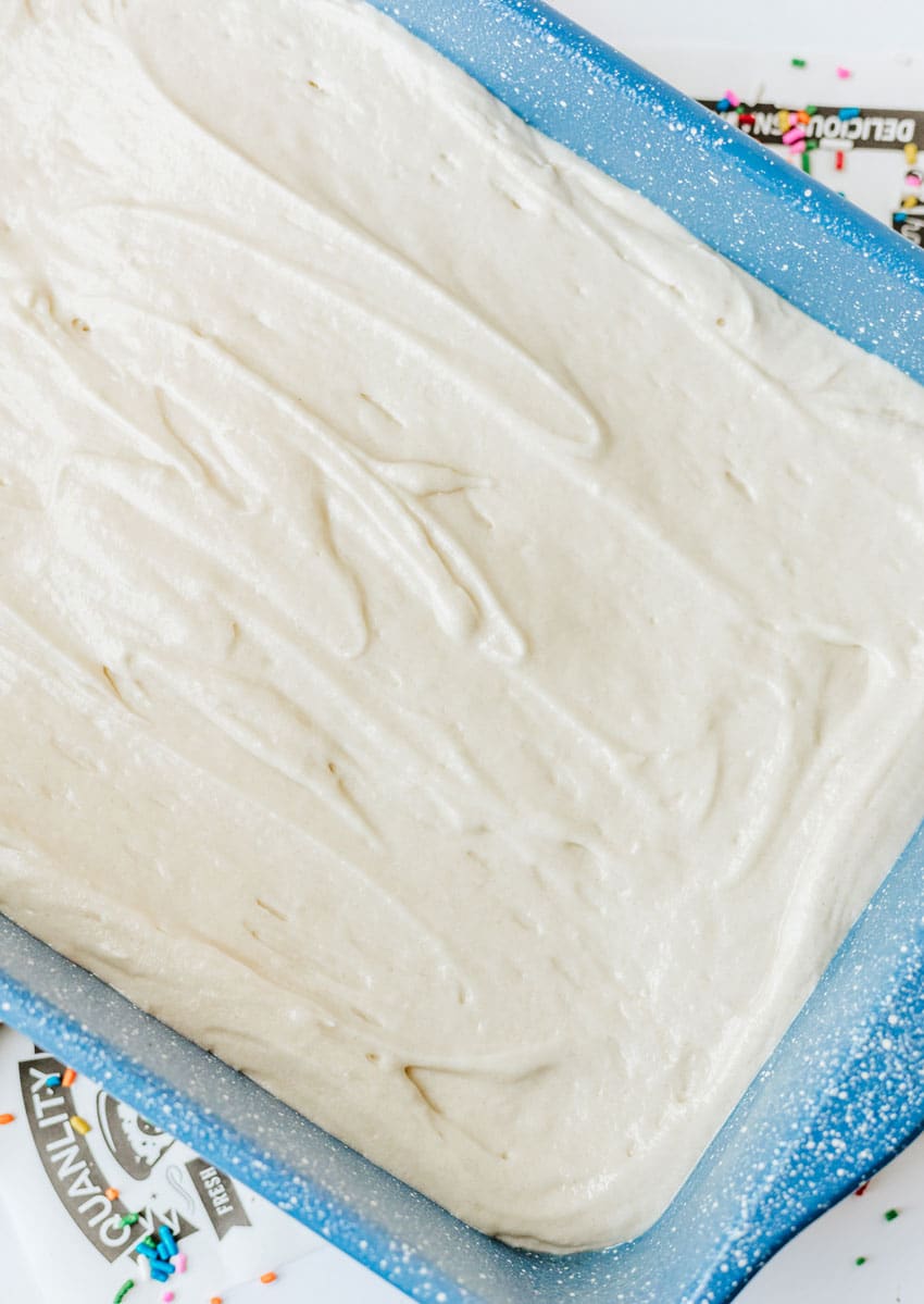 homemade yellow cake batter in a blue baking dish