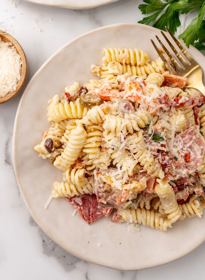 muffuletta pasta salad on a small white plate