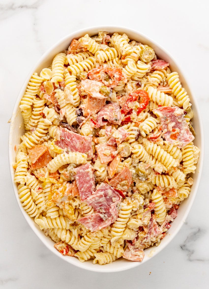 homemade Italian muffuletta pasta salad in a white serving bowl