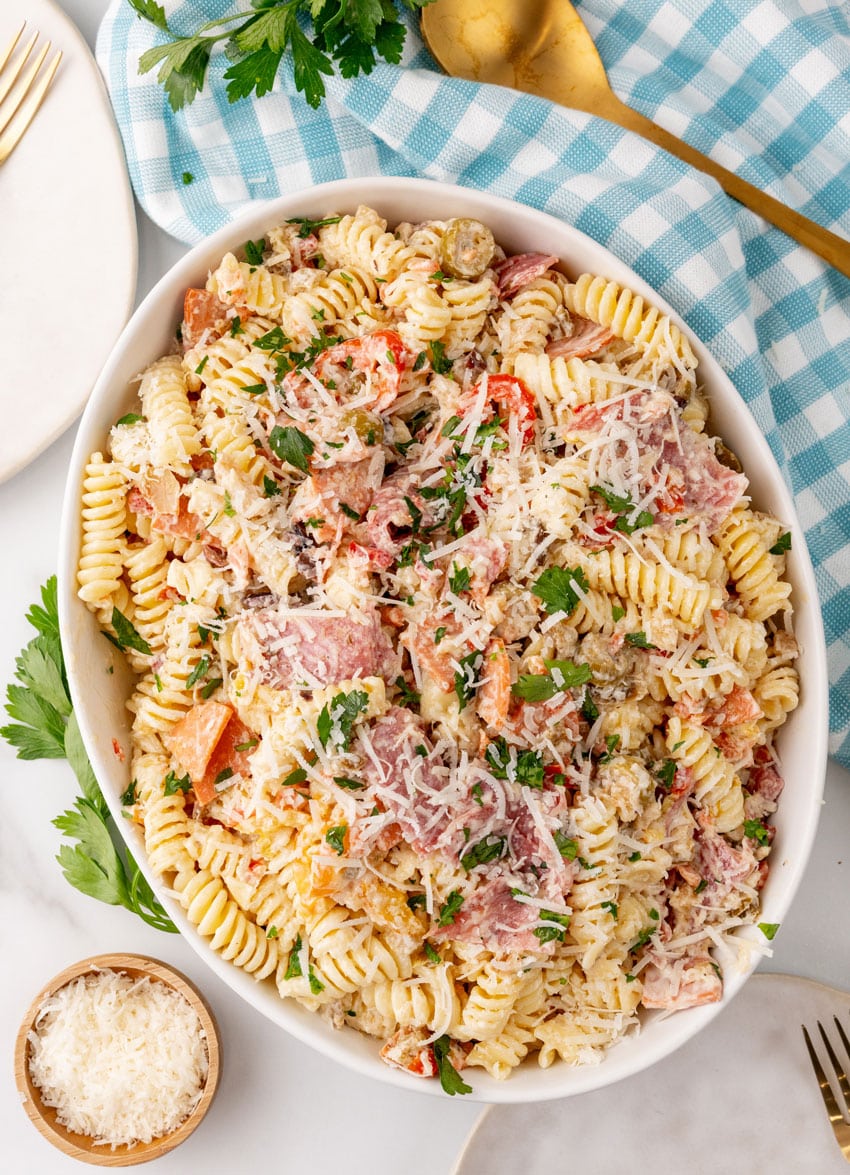 muffuletta pasta salad in a large white serving bowl