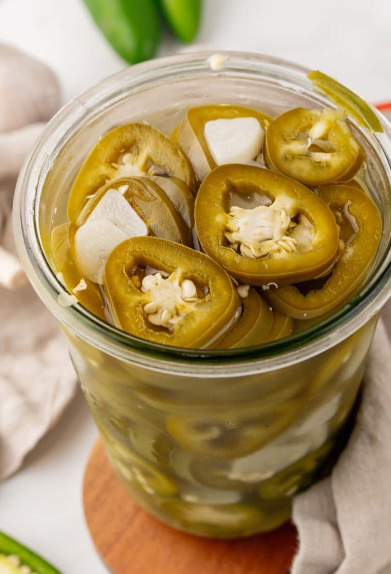 easy pickled jalapenos in a small glass jar
