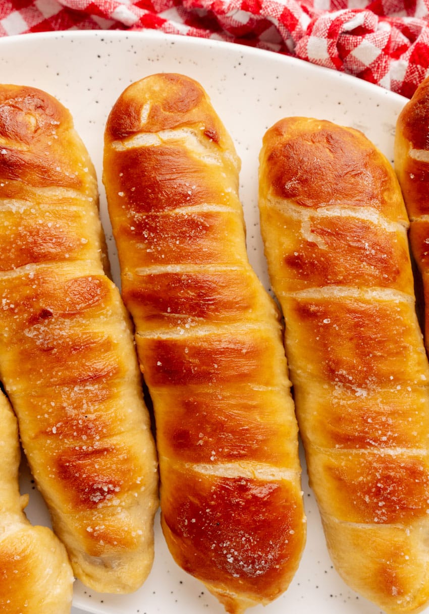 copycat Auntie Anne's pretzel dogs on a white serving plate