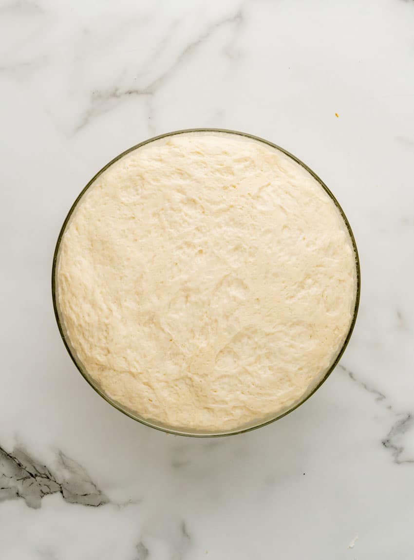 homemade pretzel dough in a glass mixing bowl