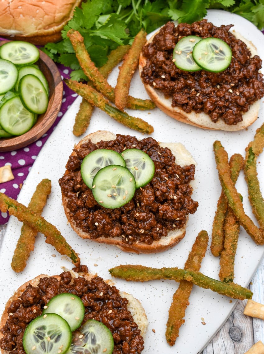 asian sloppy joes and green bean fries on a white serving platter