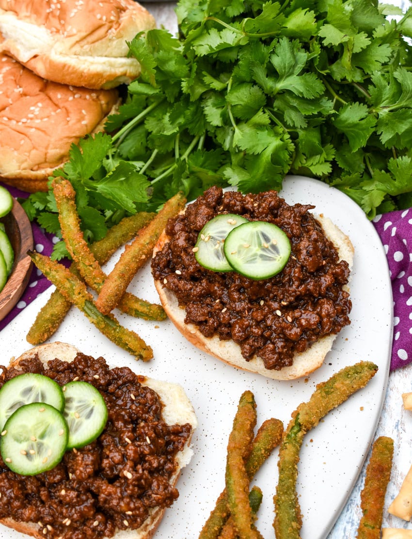 asian sloppy joes and green bean fries on a white serving platter