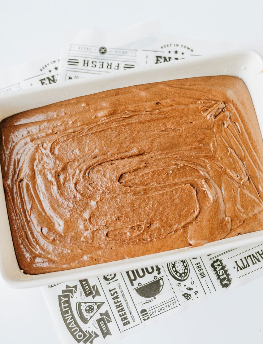homemade brownie pudding batter in a white baking dish