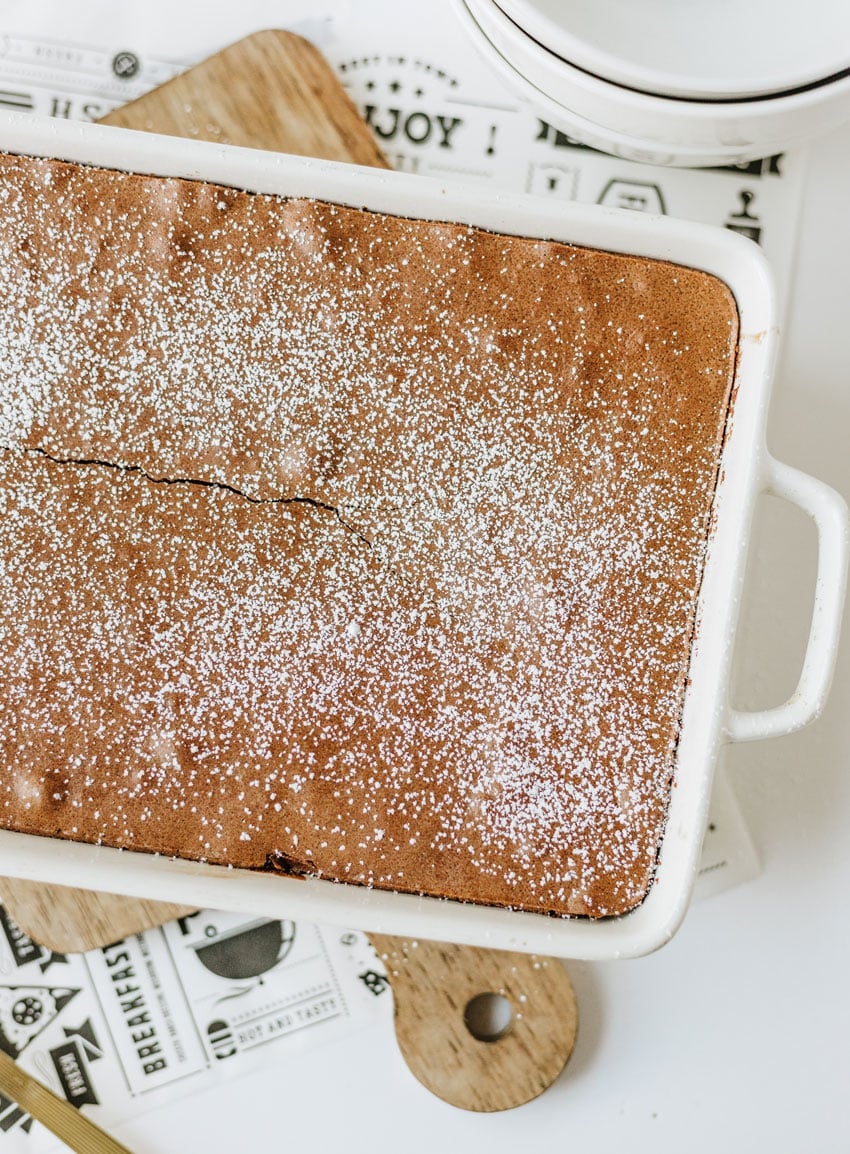 ina garten's famous baked brownie pudding in a white casserole dish