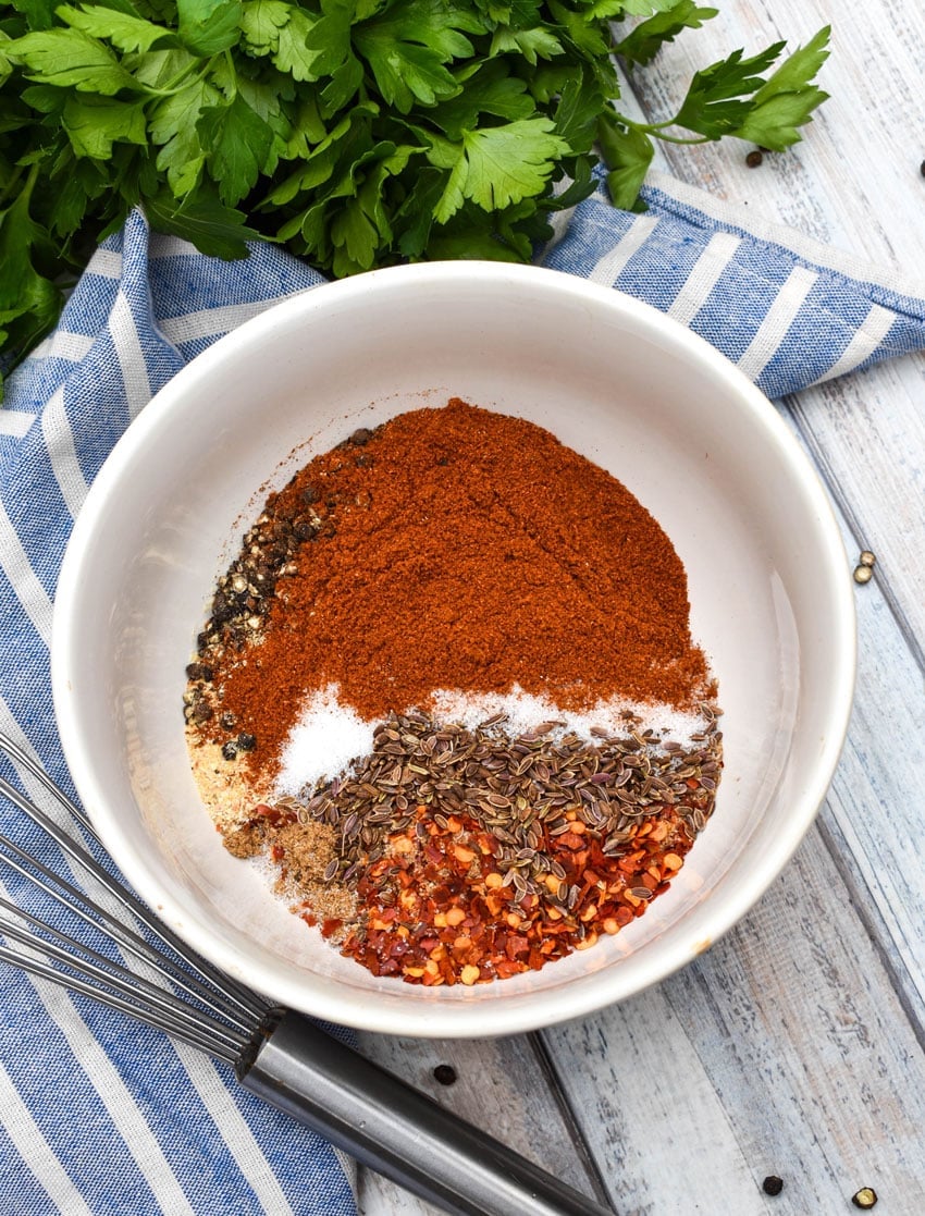 copycat montreal steak seasoning ingredients in a white bowl