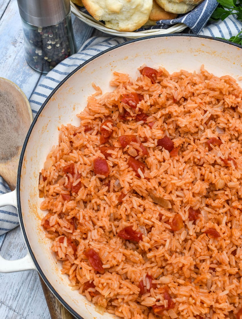 southern tomatoes and rice in a white cast iron skillet