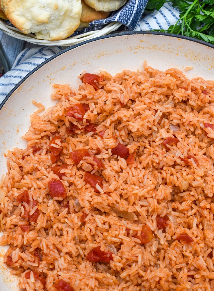 southern tomatoes and rice in a white cast iron skillet