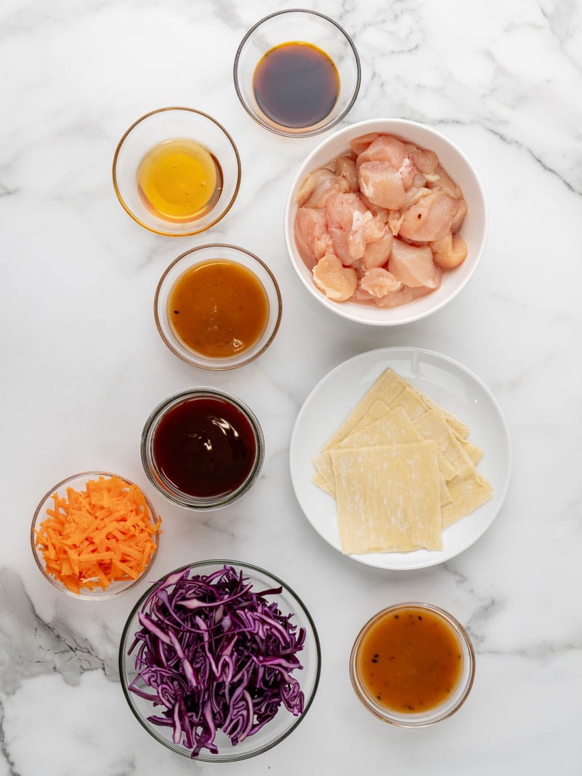 an overhead image showing the measured ingredients needed to make a batch of copycat applebee's chicken wonton tacos