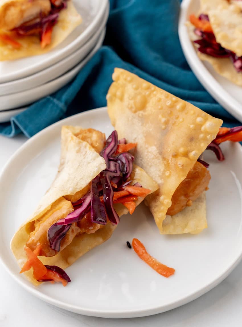 copycat applebee's chicken wonton tacos on a small white plate