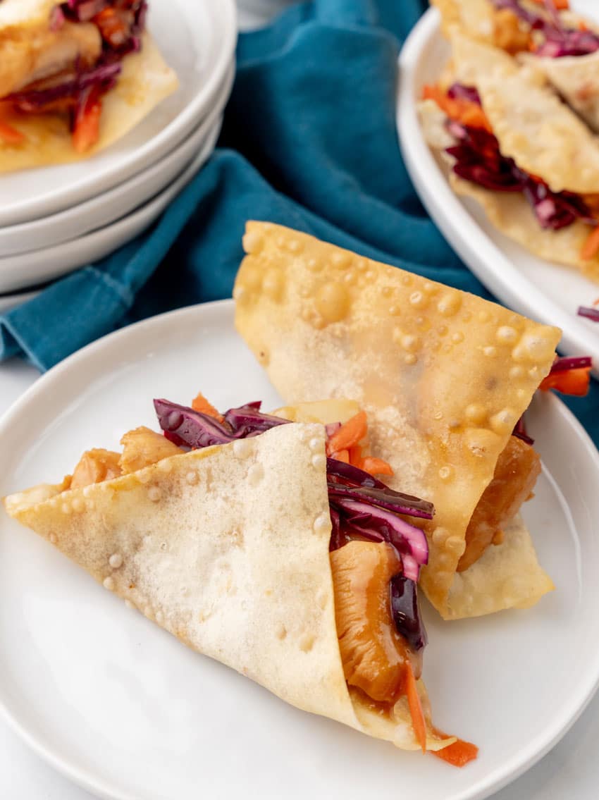 copycat applebee's chicken wonton tacos on a small white plate