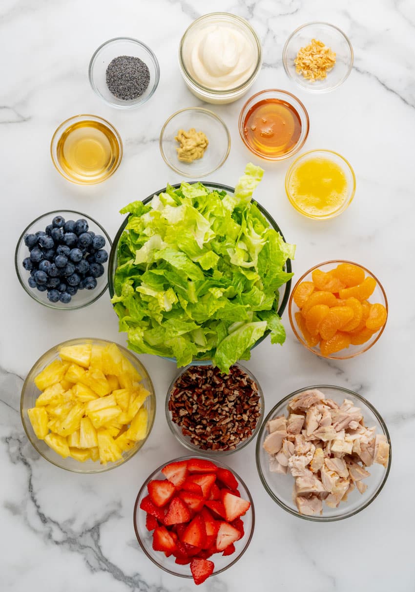 an overhead image showing the measured ingredients needed to make a homemade Copycat Panera strawberry poppyseed chicken salad