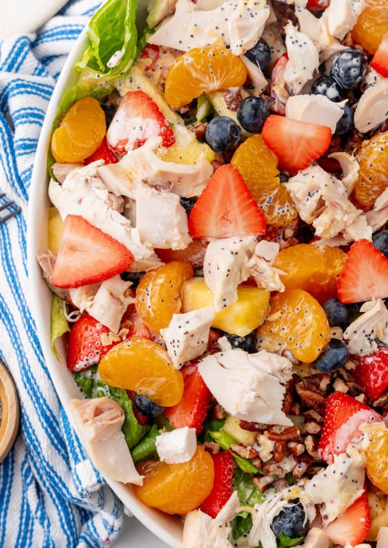 a closeup of a homemade Copycat Panera strawberry poppyseed chicken salad in a white serving dish
