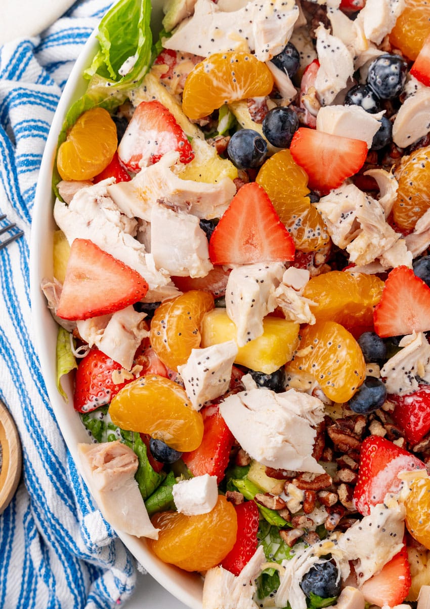 a closeup of a homemade Copycat Panera strawberry poppyseed chicken salad in a white serving dish