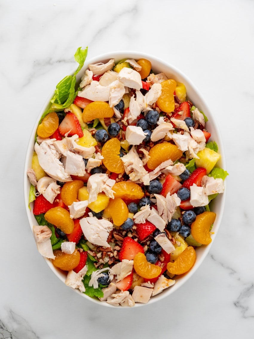 a homemade Copycat Panera strawberry poppyseed chicken salad in a white serving bowl
