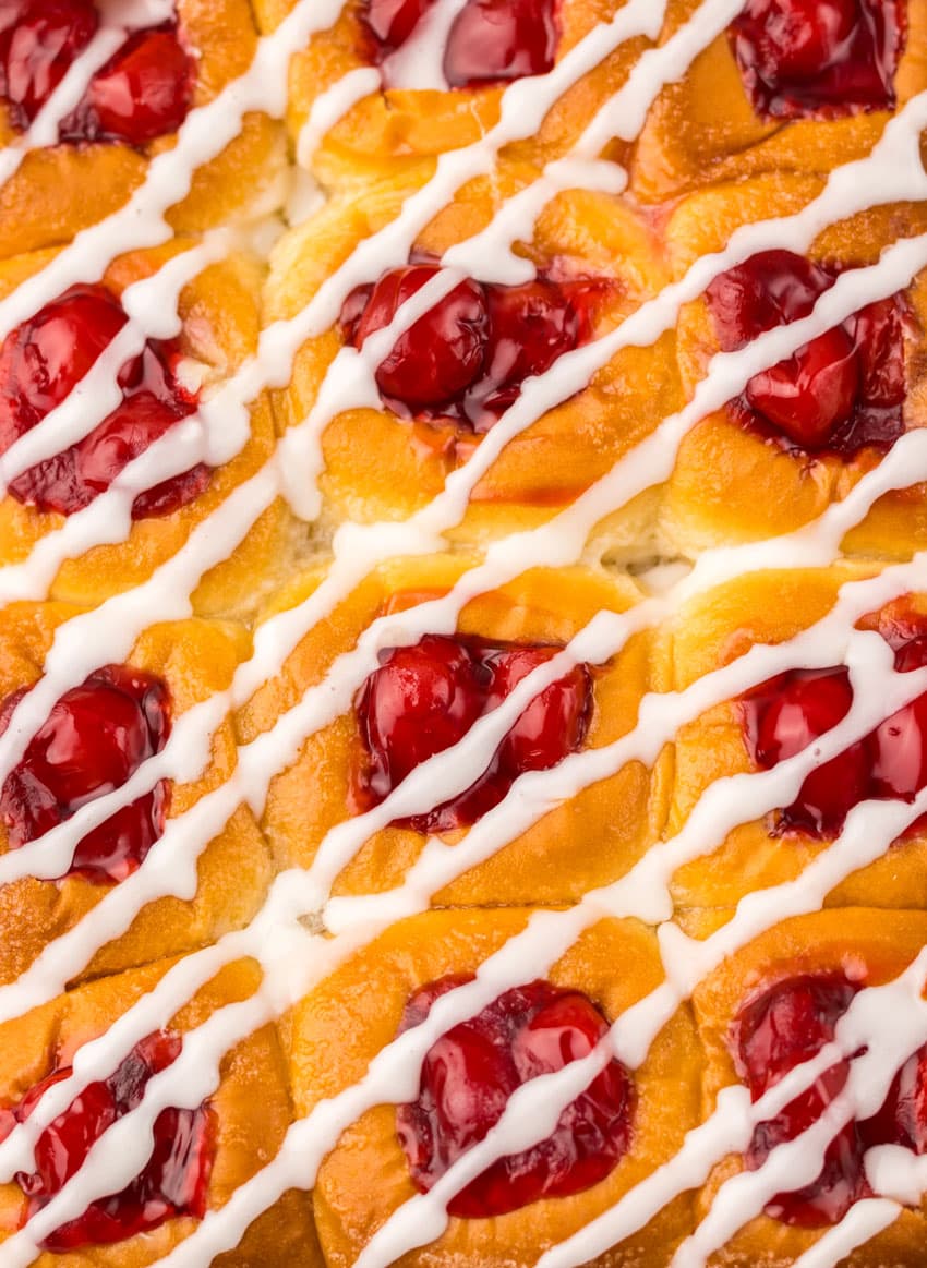 a close up of glazed cherry danish hawaiian rolls