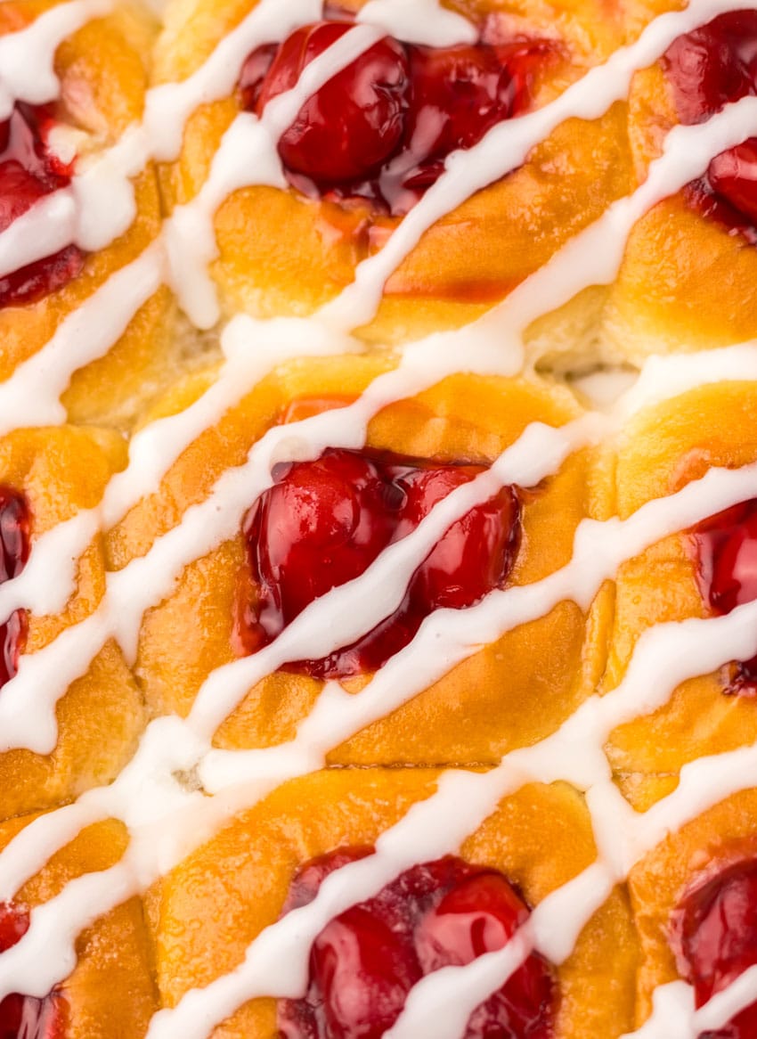 a close up of glazed cherry danish hawaiian rolls