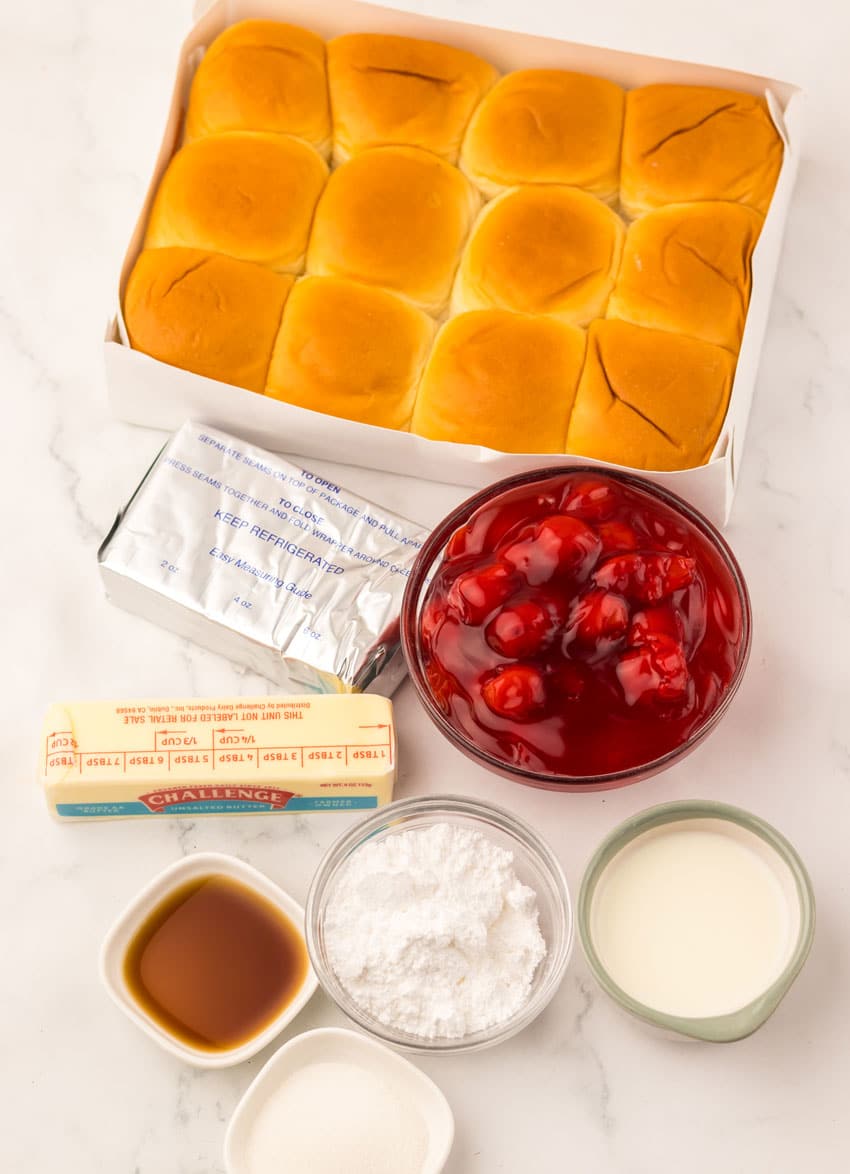 an overhead image showing the measured ingredients needed to make a batch of cherry danish hawaiian rolls