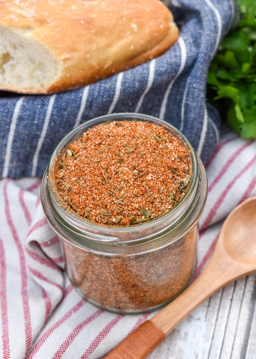 a homemade creole seasoning mix in a small glass jar