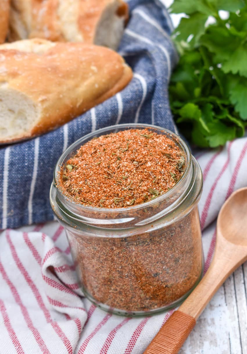 a homemade creole seasoning mix in a small glass jar