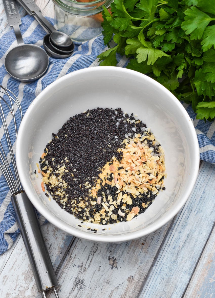 homemade everything bagel seasoning ingredients in a small white bowl
