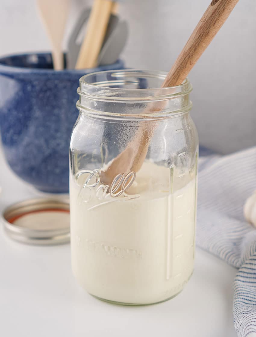 homemade sour cream in a large glass mason jar