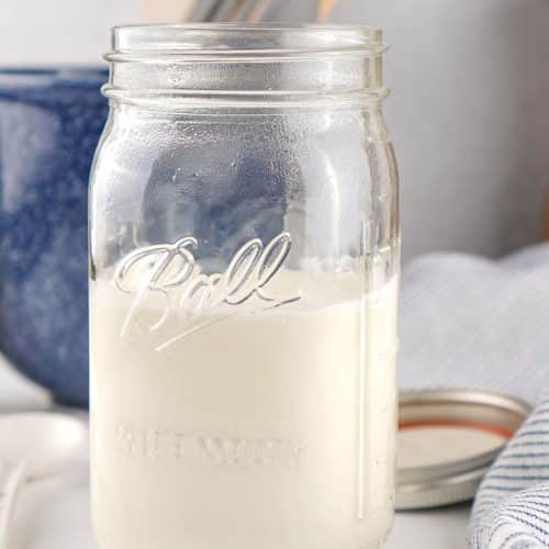 homemade sour cream in a large glass mason jar