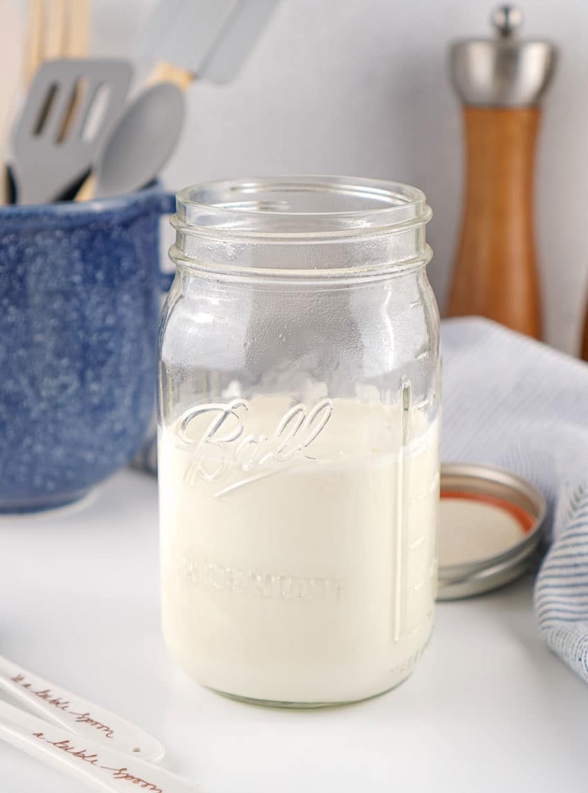 homemade sour cream in a large glass mason jar