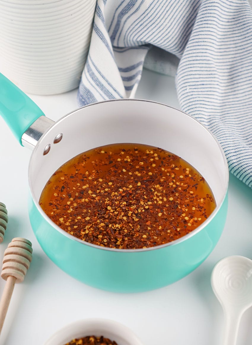 homemade hot honey ingredients in a small kitchen pot