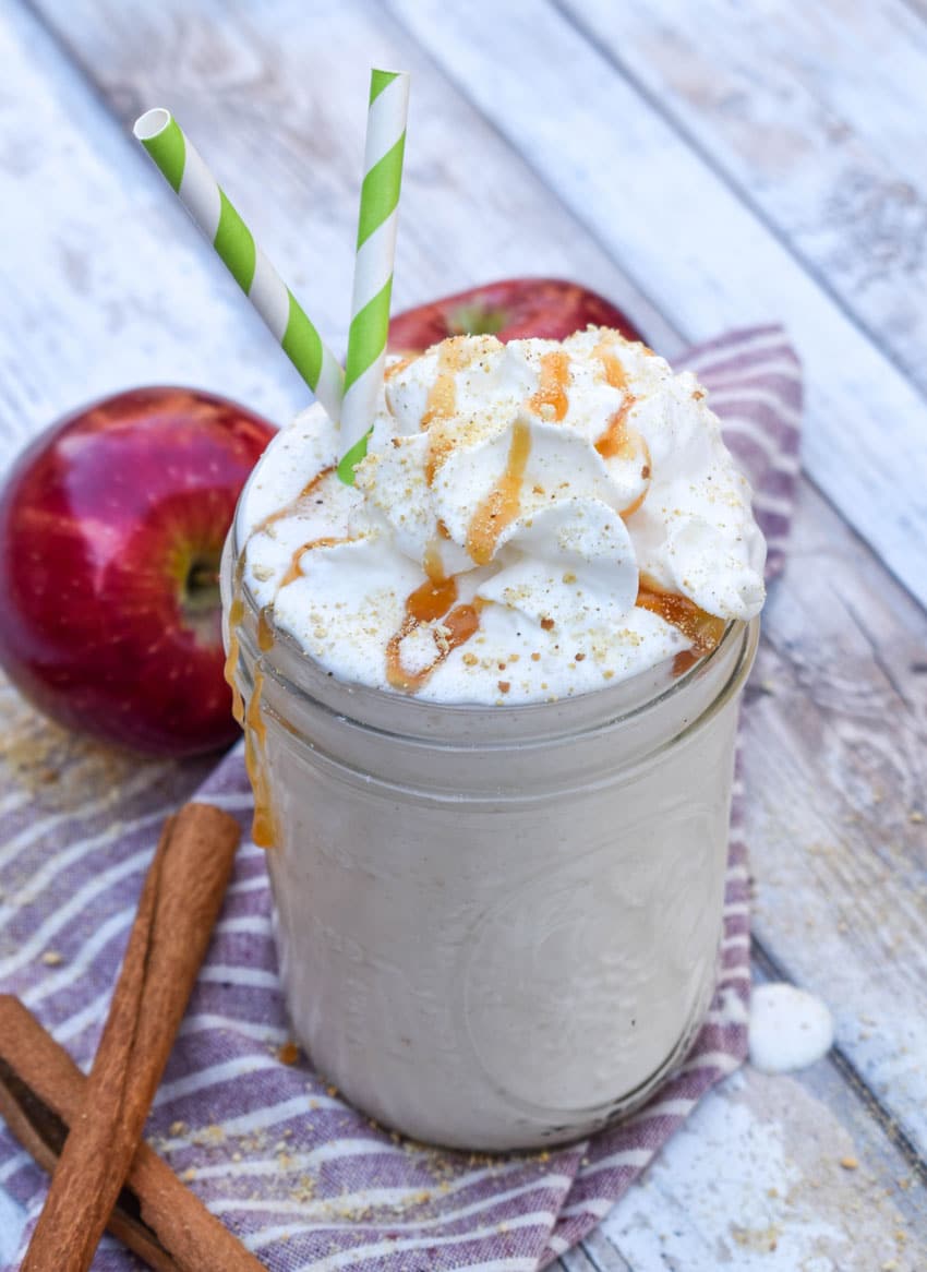 an apple pie milkshake in a small glass jar