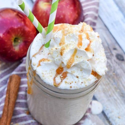 an apple pie milkshake in a small glass jar