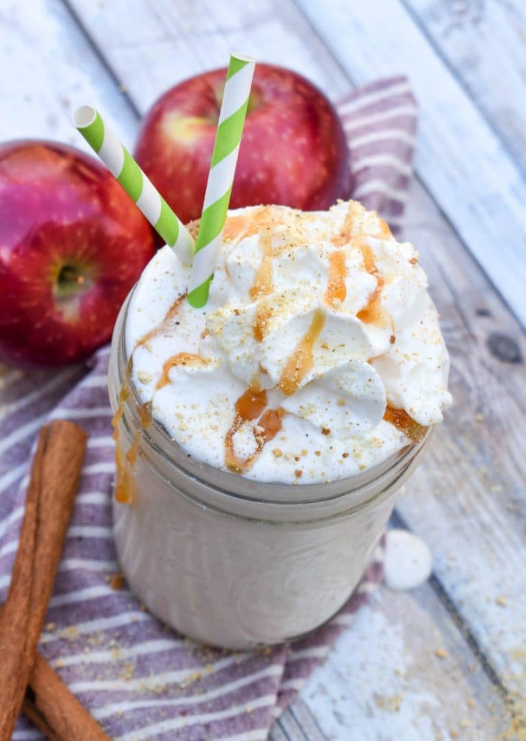 an apple pie milkshake in a small glass jar