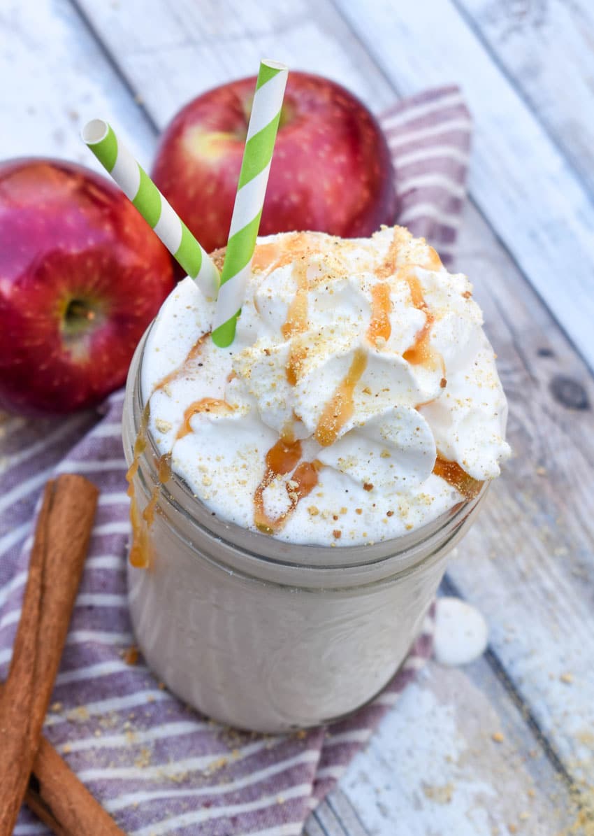 an apple pie milkshake in a small glass jar