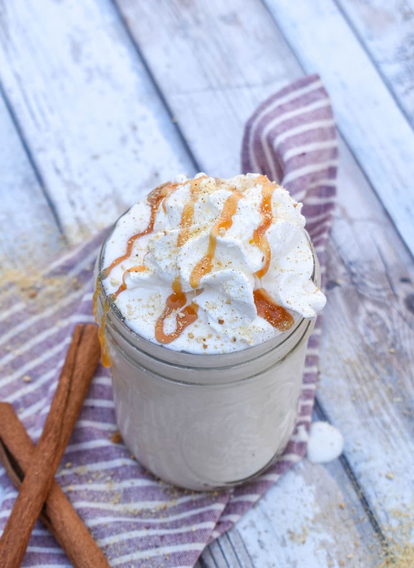 a homemade apple pie milkshake in a small glass jar