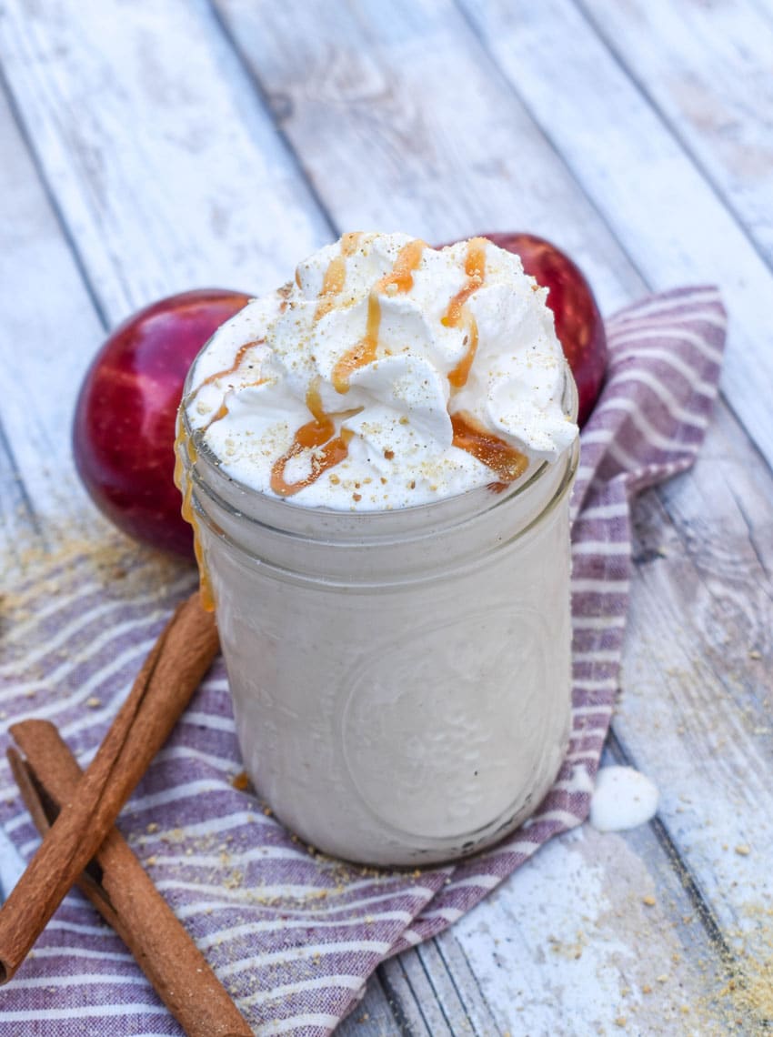 an apple pie milkshake in a small glass jar
