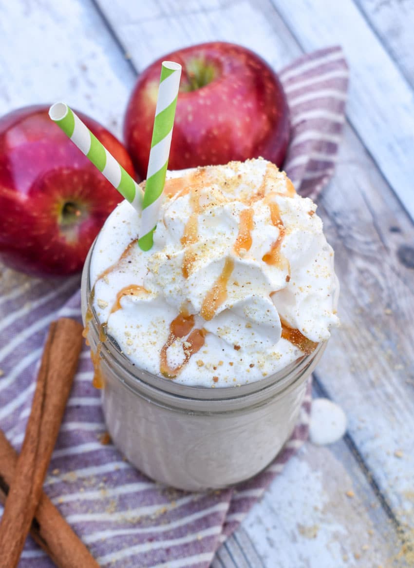 an apple pie milkshake in a small glass jar