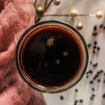 homemade elderberry syrup in a small glass jar