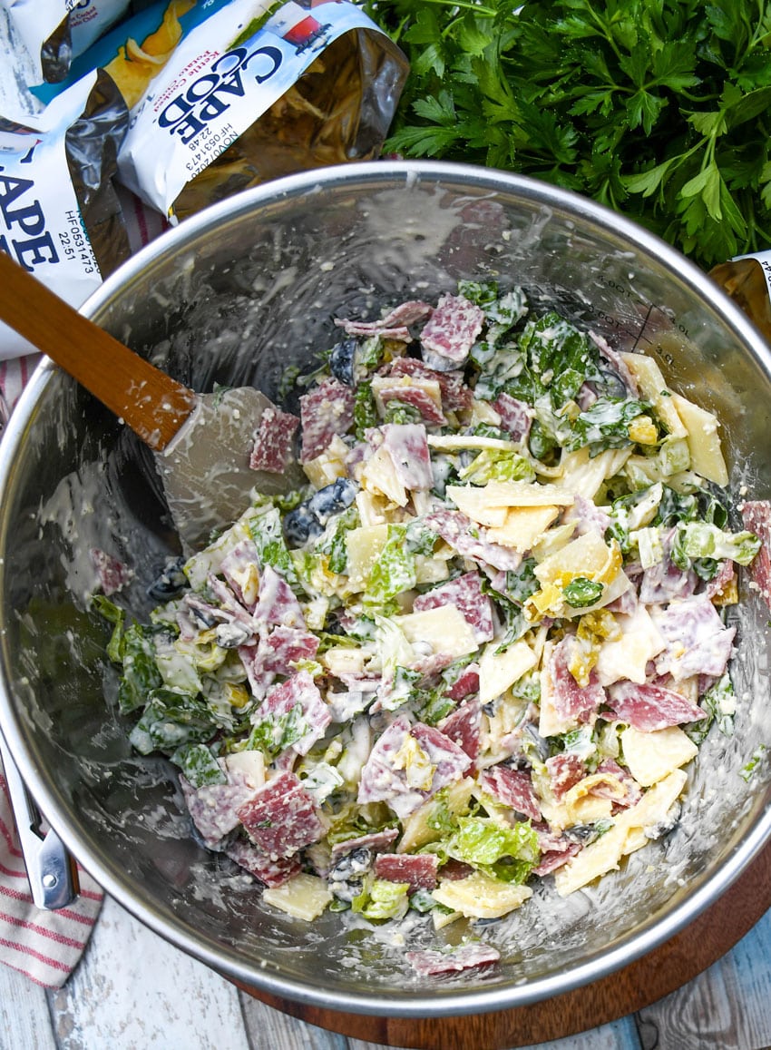 Italian sub sandwich filling in a metal mixing bowl