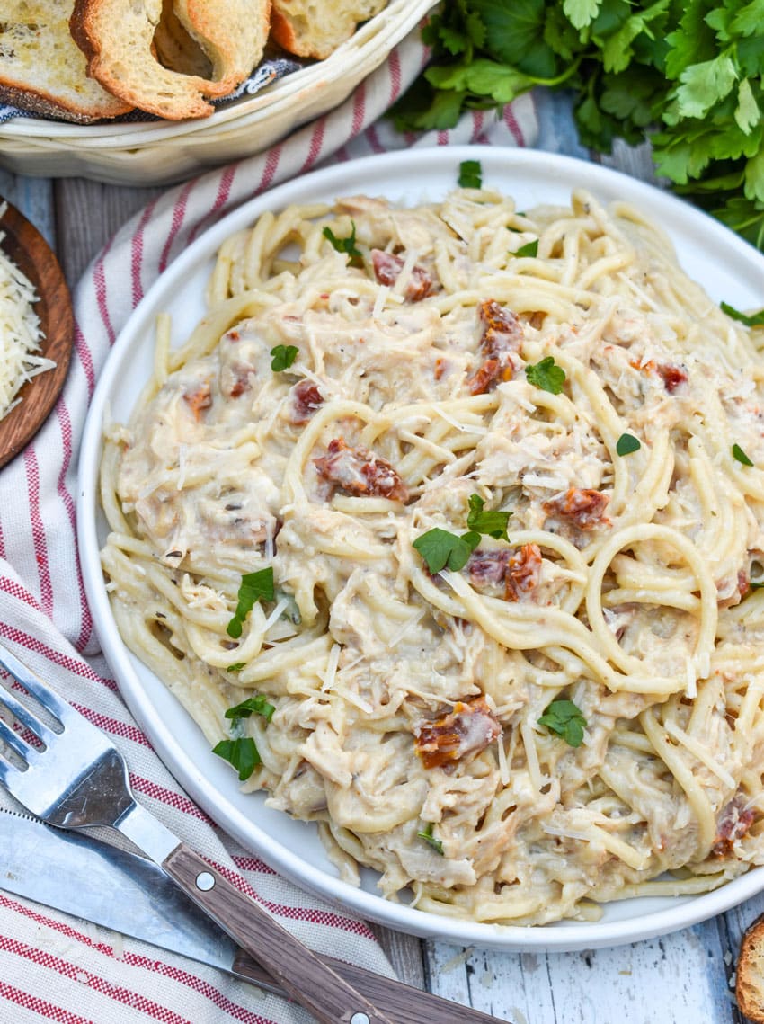 slow cooker marry me chicken on a white dinner plate