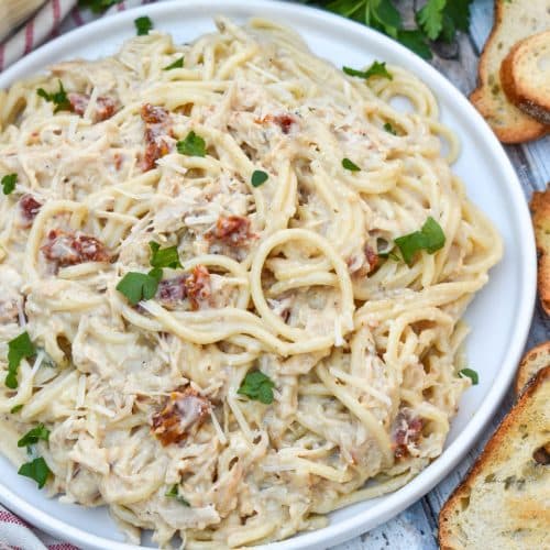 slow cooker marry me chicken on a white dinner plate