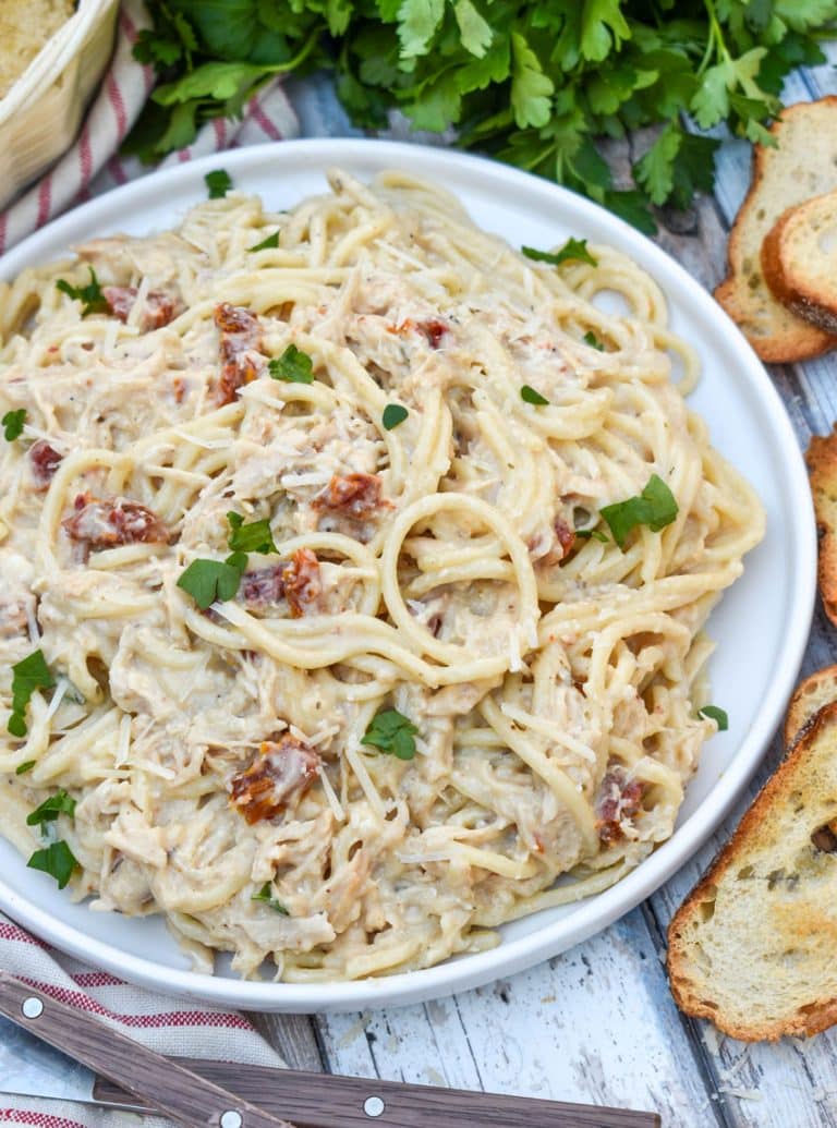 slow cooker marry me chicken on a white dinner plate